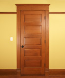 An image of a stained interior wood door